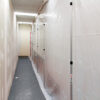 Zipwall Dust Barrier Poles in-use Commercial